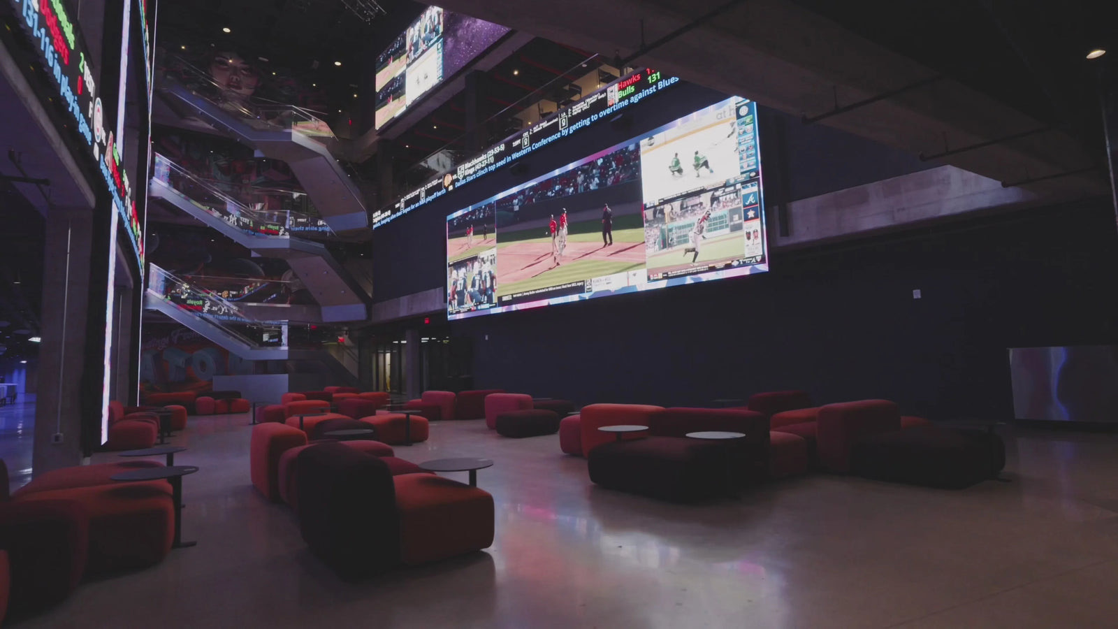 Atomic Golf Las Vegas illuminated tech-enabled driving range tower at night