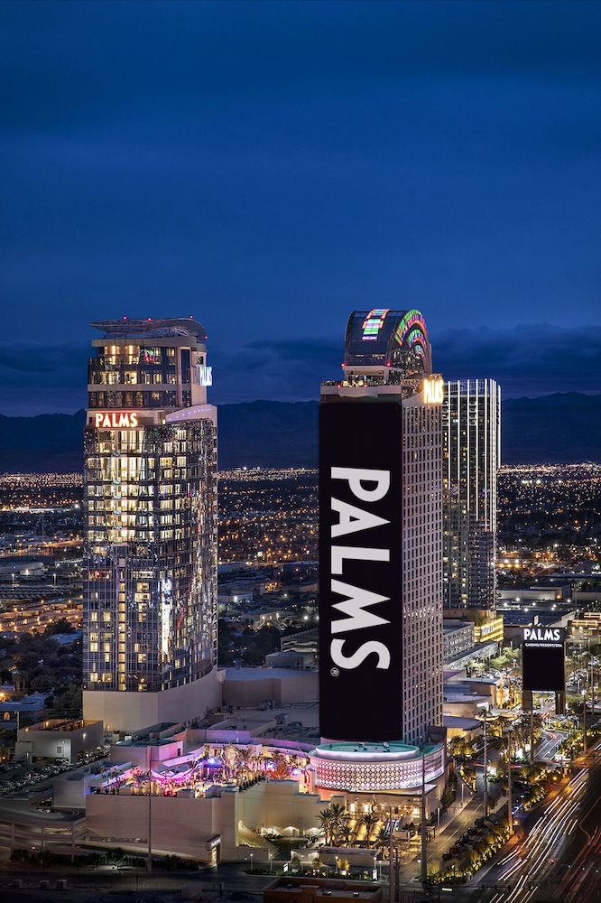Palms Casino Resort twin towers off the Strip in Las Vegas lit at dusk
